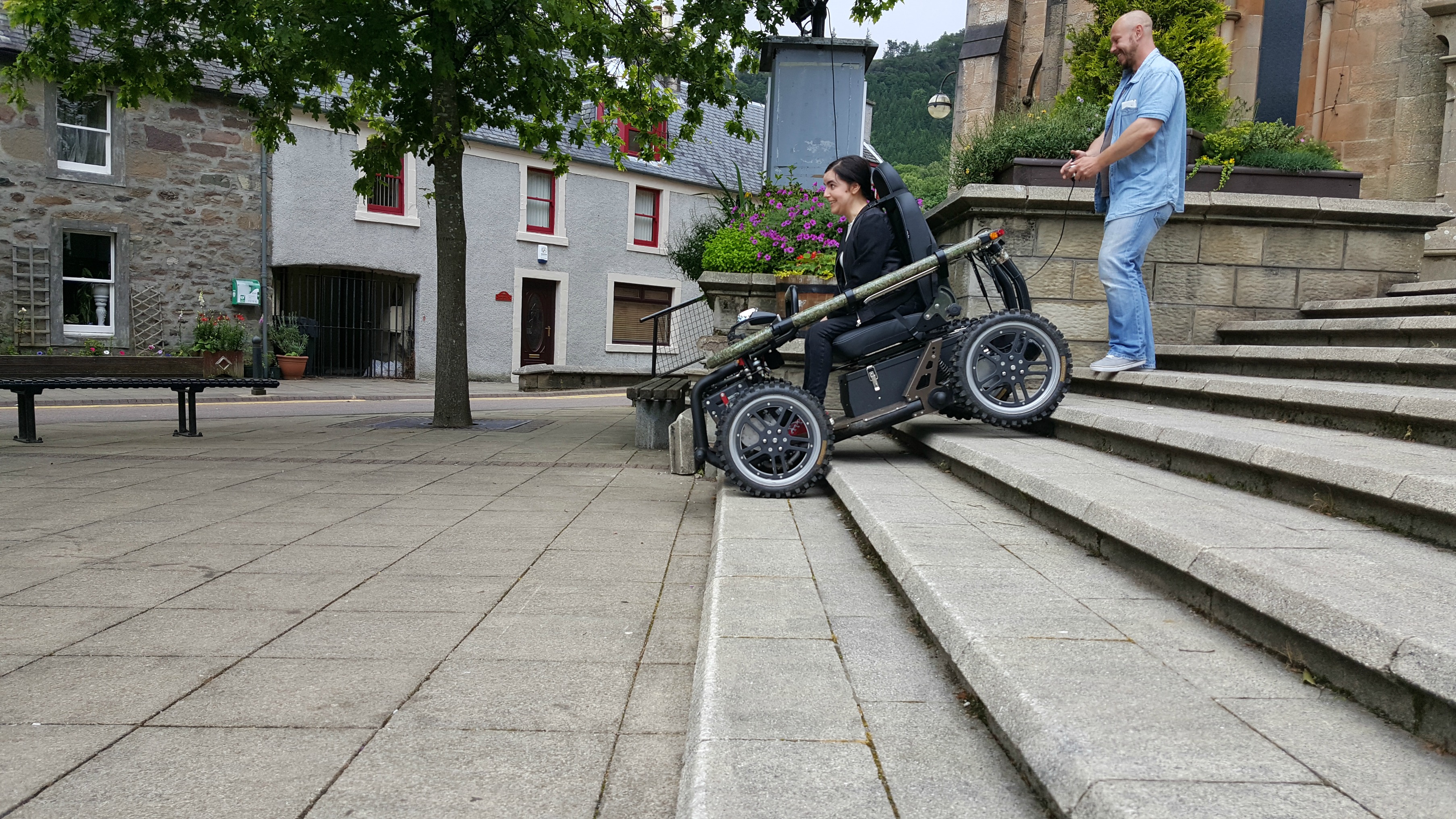 simply emma driving all-terrain-wheelchair down steps callander