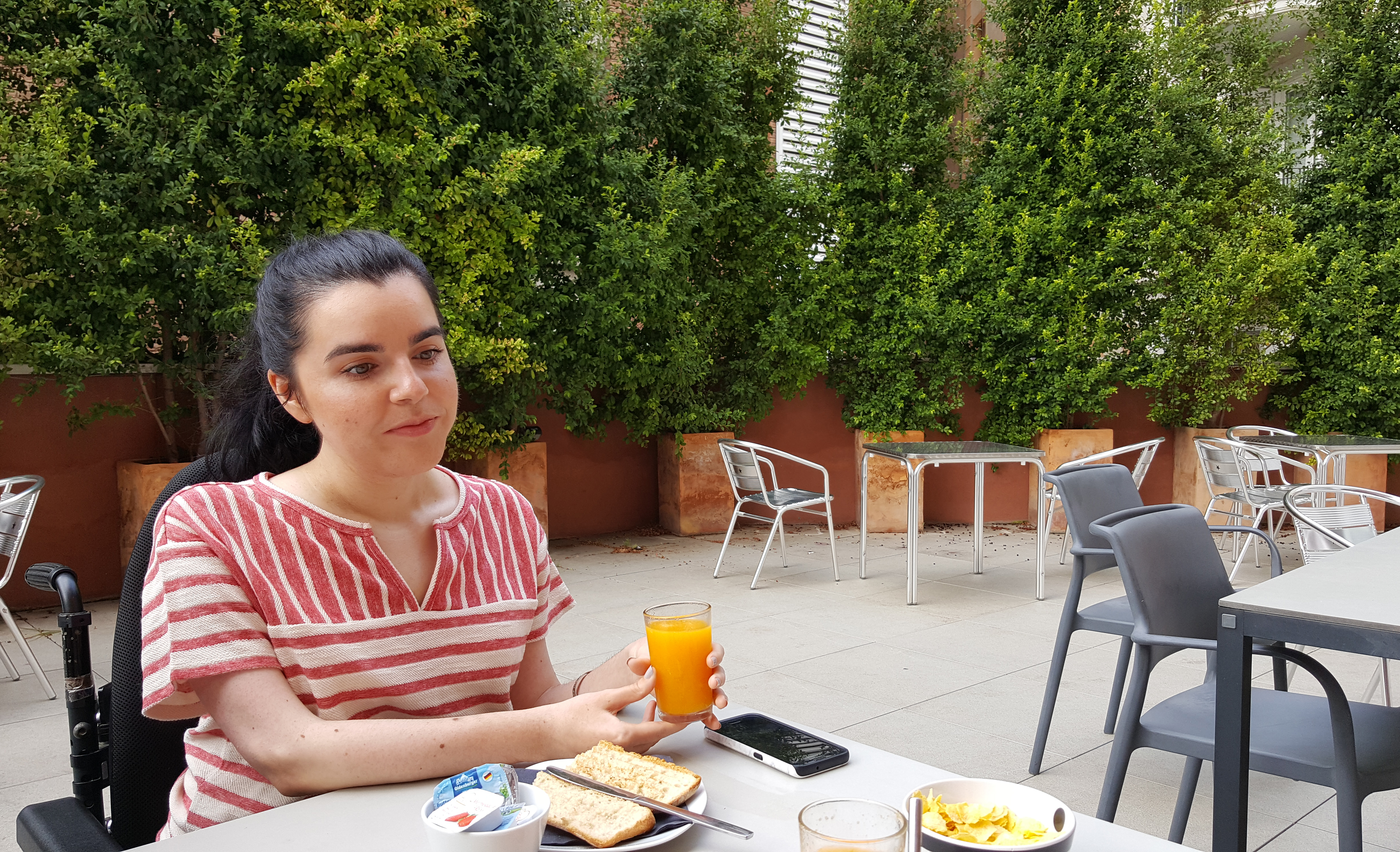 mics-sant-jordi-outdoor-dining-terrace-wheelchair-user-eating-breakfast