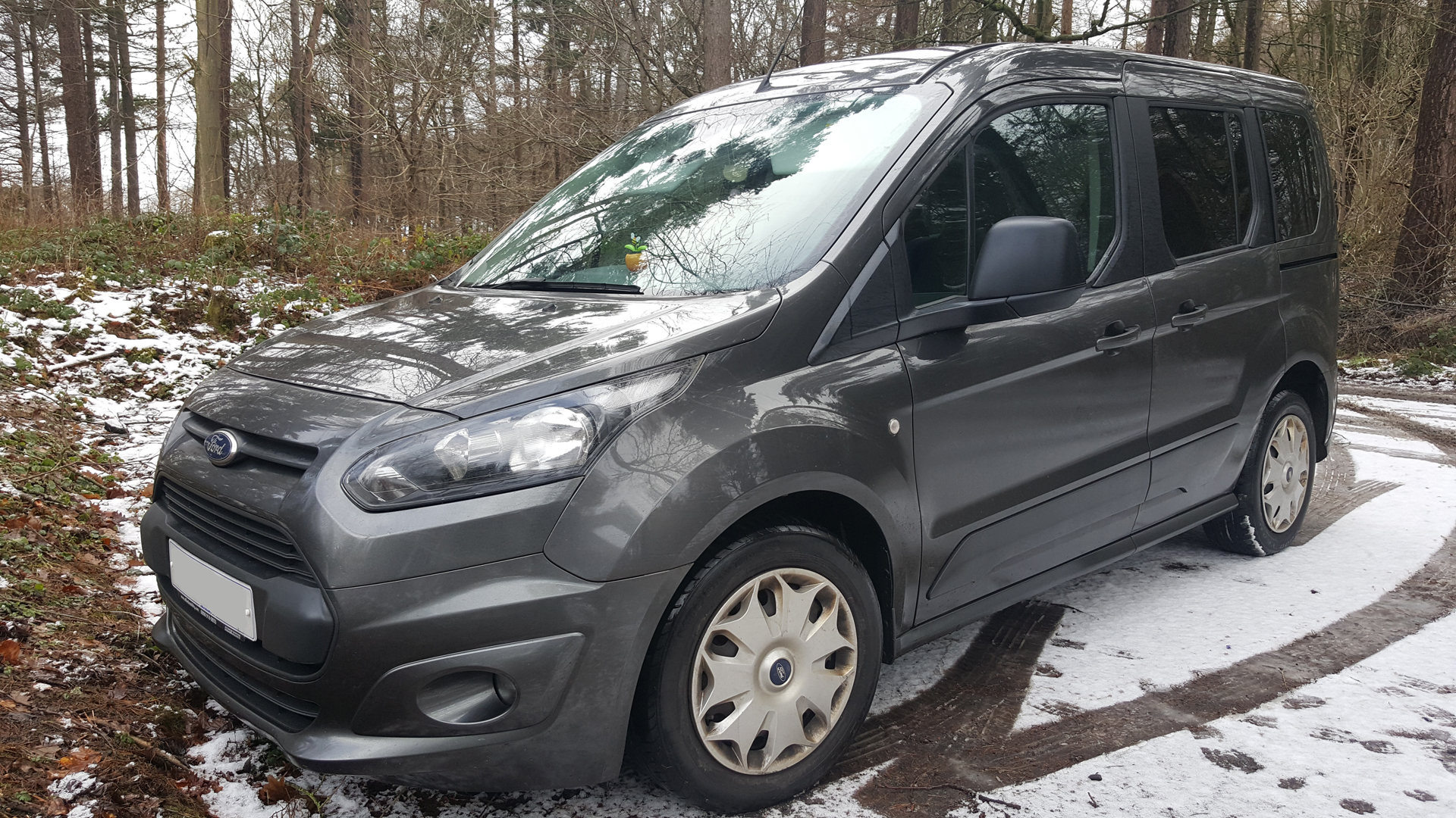 Ford Connect Freedom™ WAV parked on a snowy road surrounded by snow covered trees: 6 Top Tips How to Choose The Best Wheelchair Accessible Vehicle (WAV)