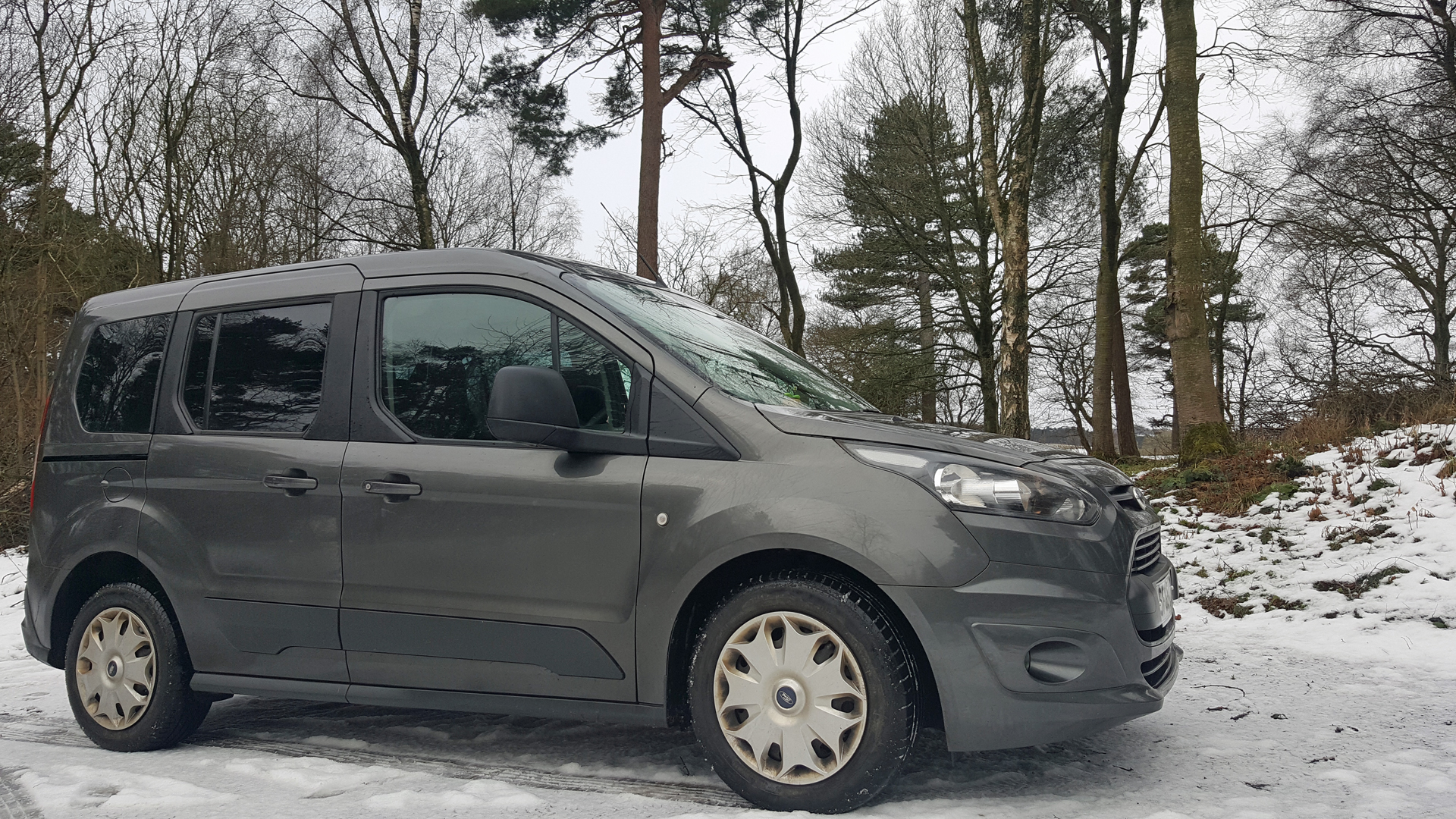 Ford Connect Freedom™ WAV parked on a snowy road surrounded by snow covered trees: 6 Top Tips How to Choose The Best Wheelchair Accessible Vehicle (WAV)