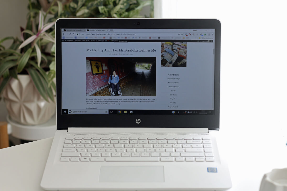 Photo of my laptop with my blog on the screen. It's focusing on my blog post titled 'My Identity and how my disability defines me'.