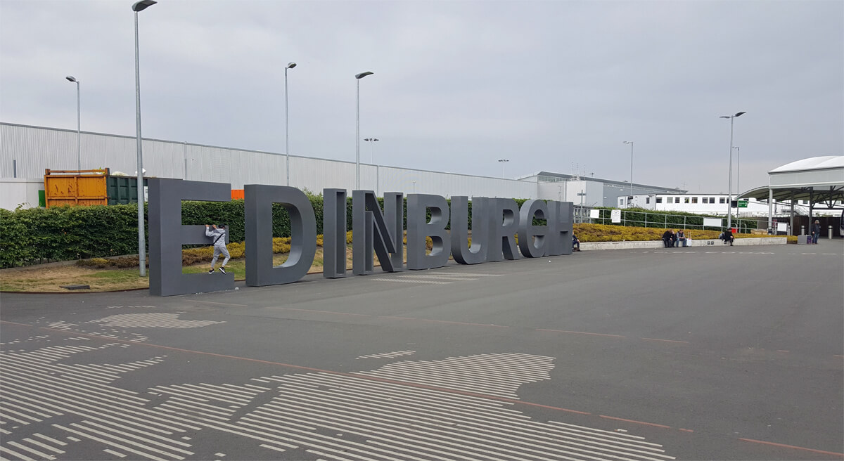 This image is of huge life-size letters spelling Edinburgh which is located outside of departures at Edinburgh Airport.