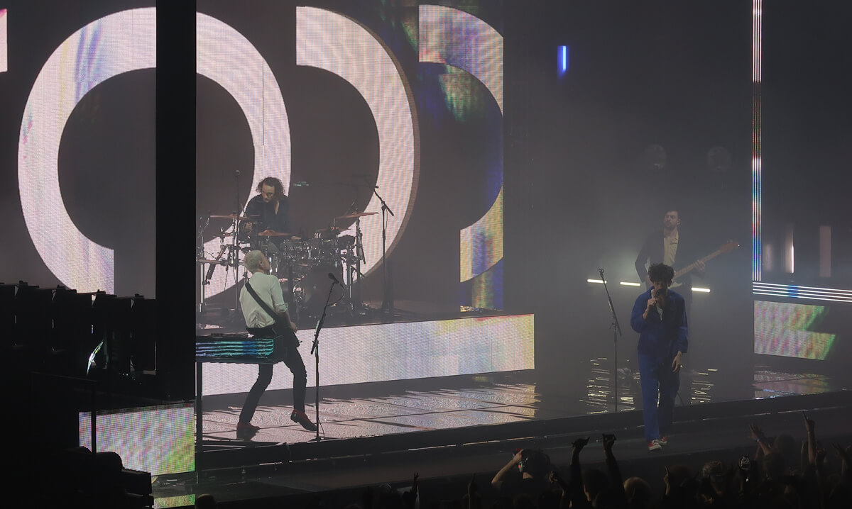 The 1975 performing on stage at FlyDSA Arena