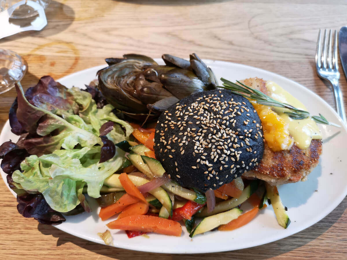 Vegan burger with black bun from Flax & Kale Tallers.