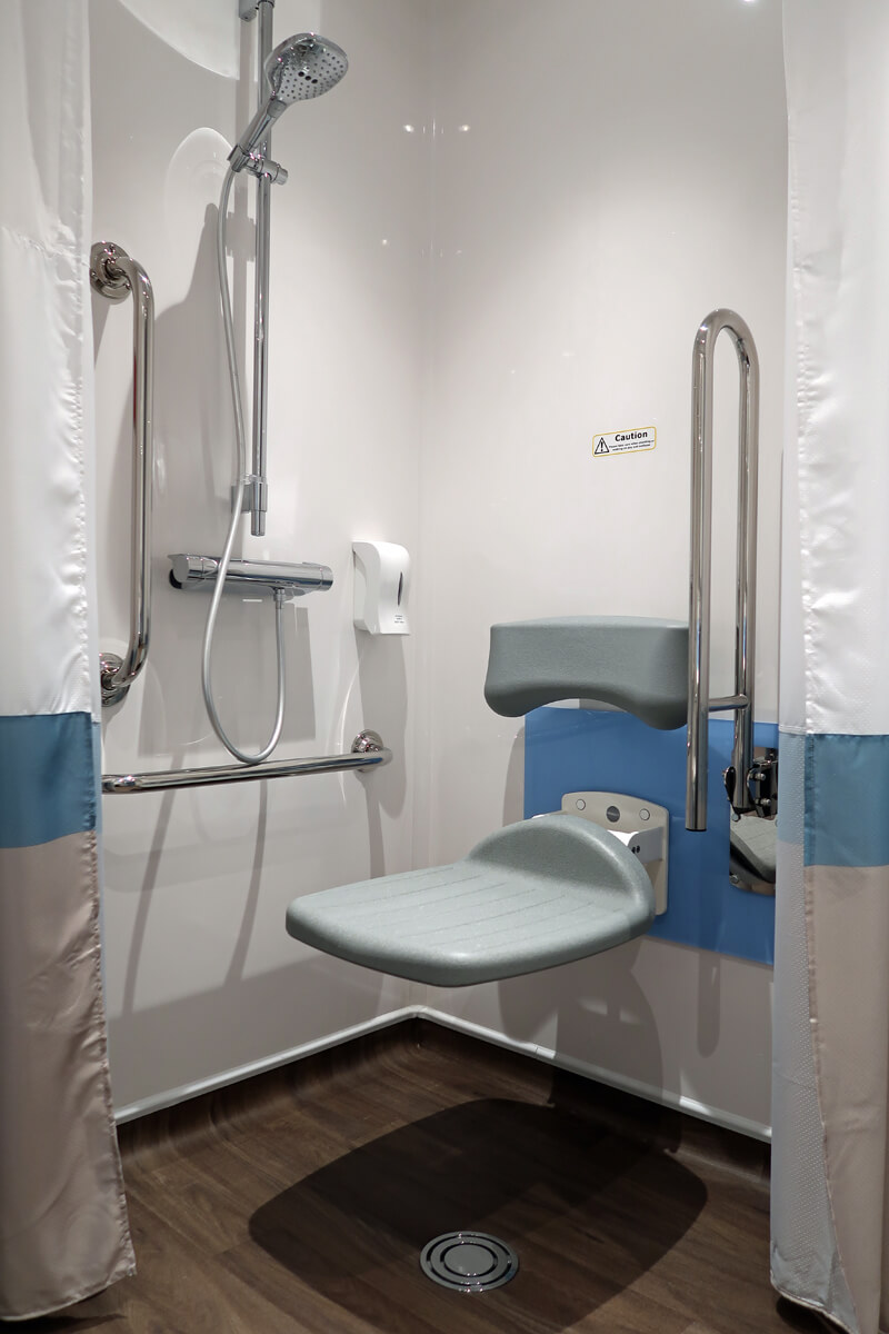 Travelodge Solihull wheelchair accessible SuperRoom bathroom with roll-in shower.