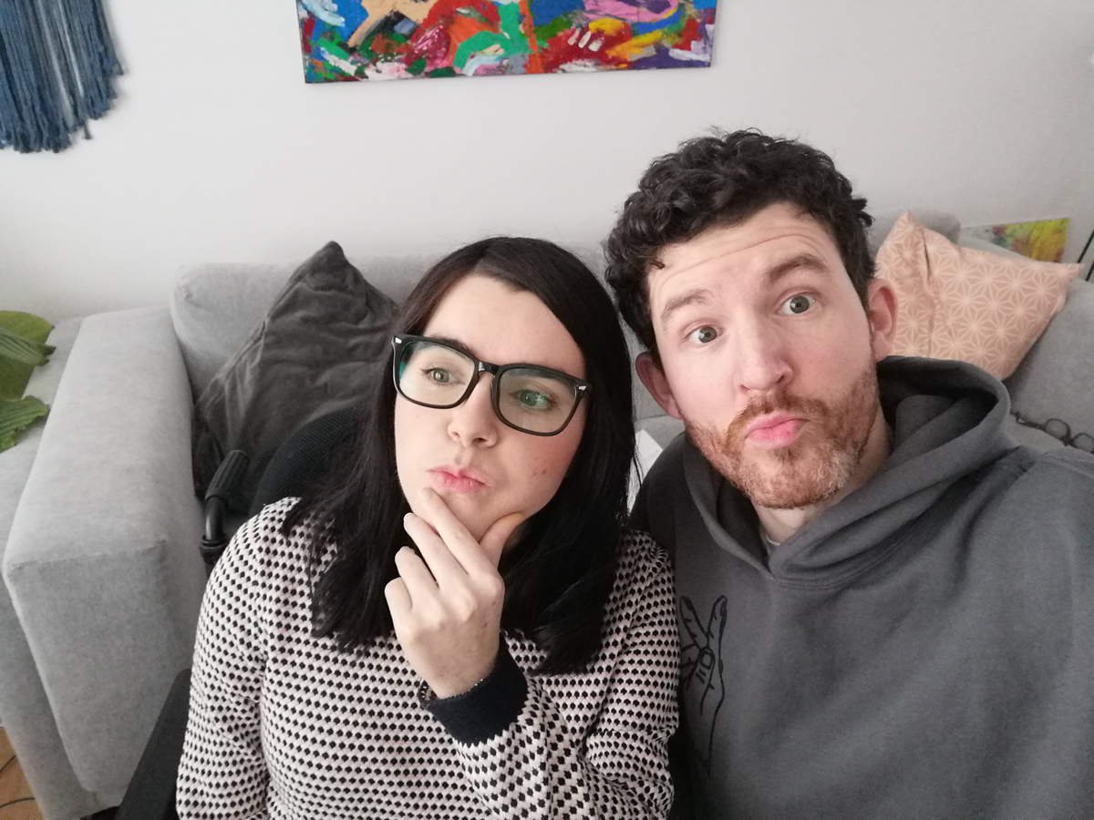 Emma and Allan sitting in their livingroom looking depth in though