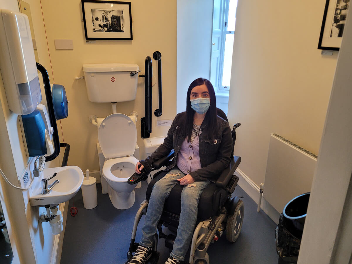 Emma sat in her power wheelchair inside the disabled toilet at Callendar House.