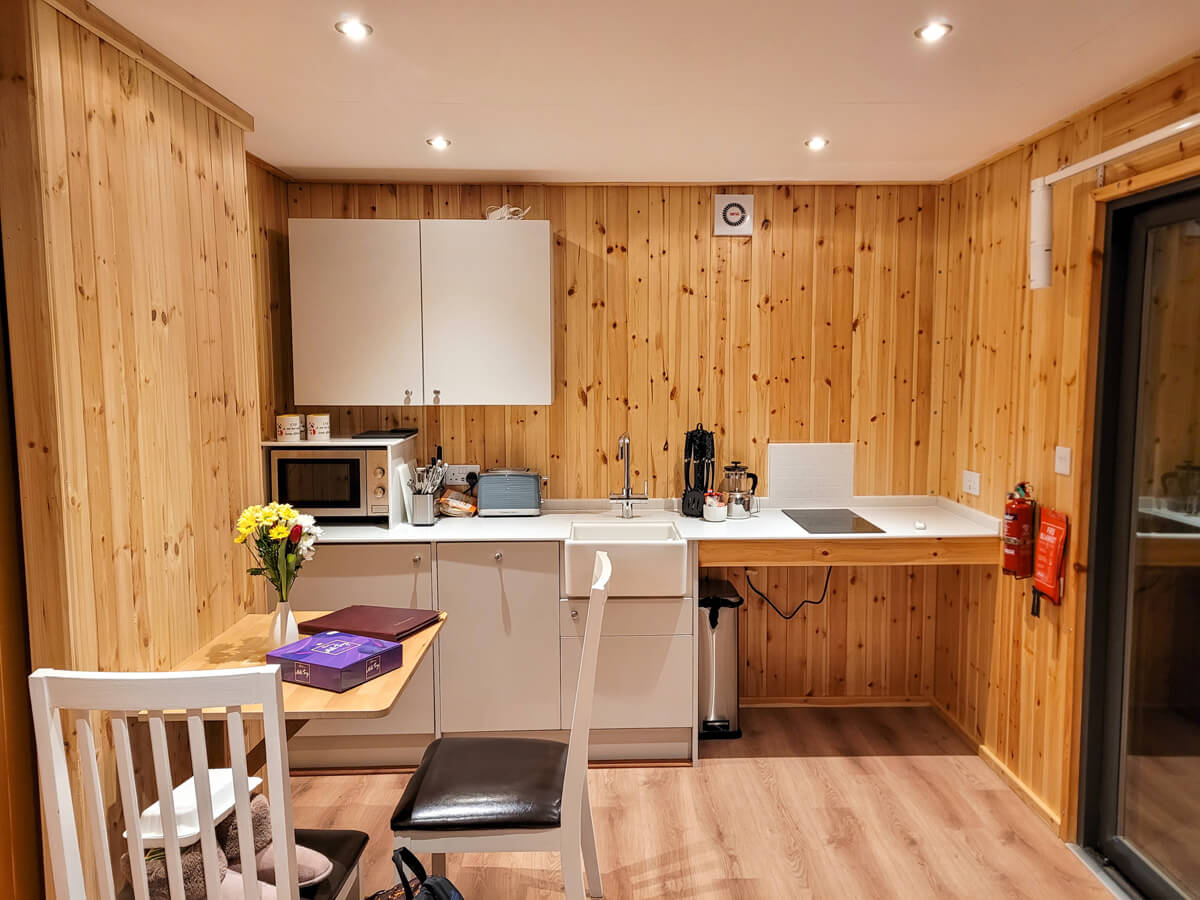 Kitchen an dining area in the accessible glamping pod at Callander CYP.