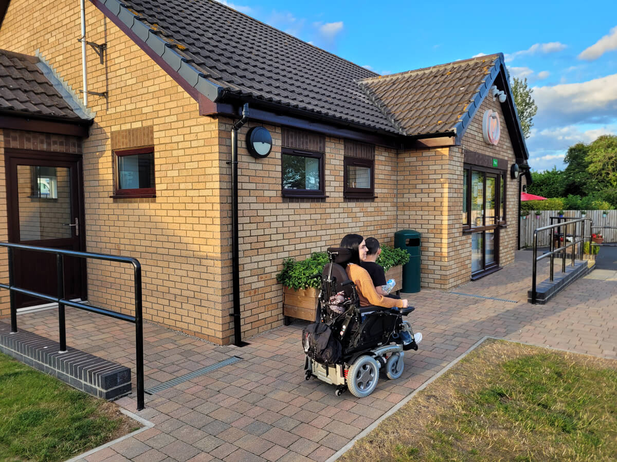 Emma sat in her wheelchair outside the Cayton Village reception office.