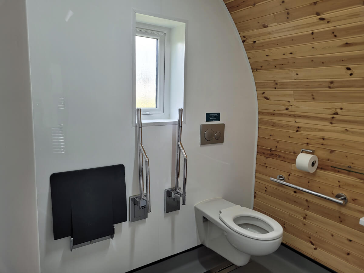 Roll-in shower in the wetroom bathroom in the wheelchair accessible glamping pod at Cayton Village.