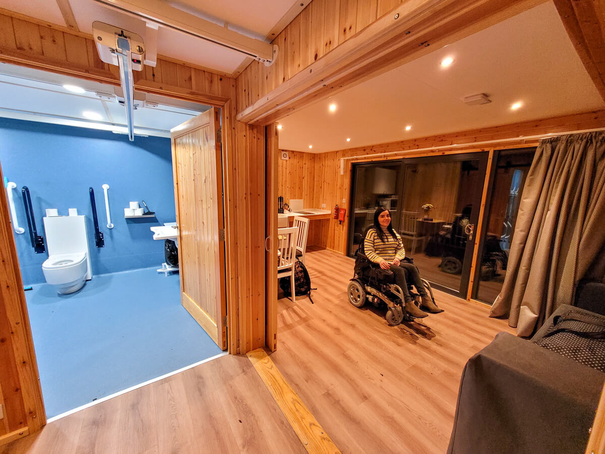 Emma sat in her powered wheelchair inside the crags accessible pod at Callander CYP.