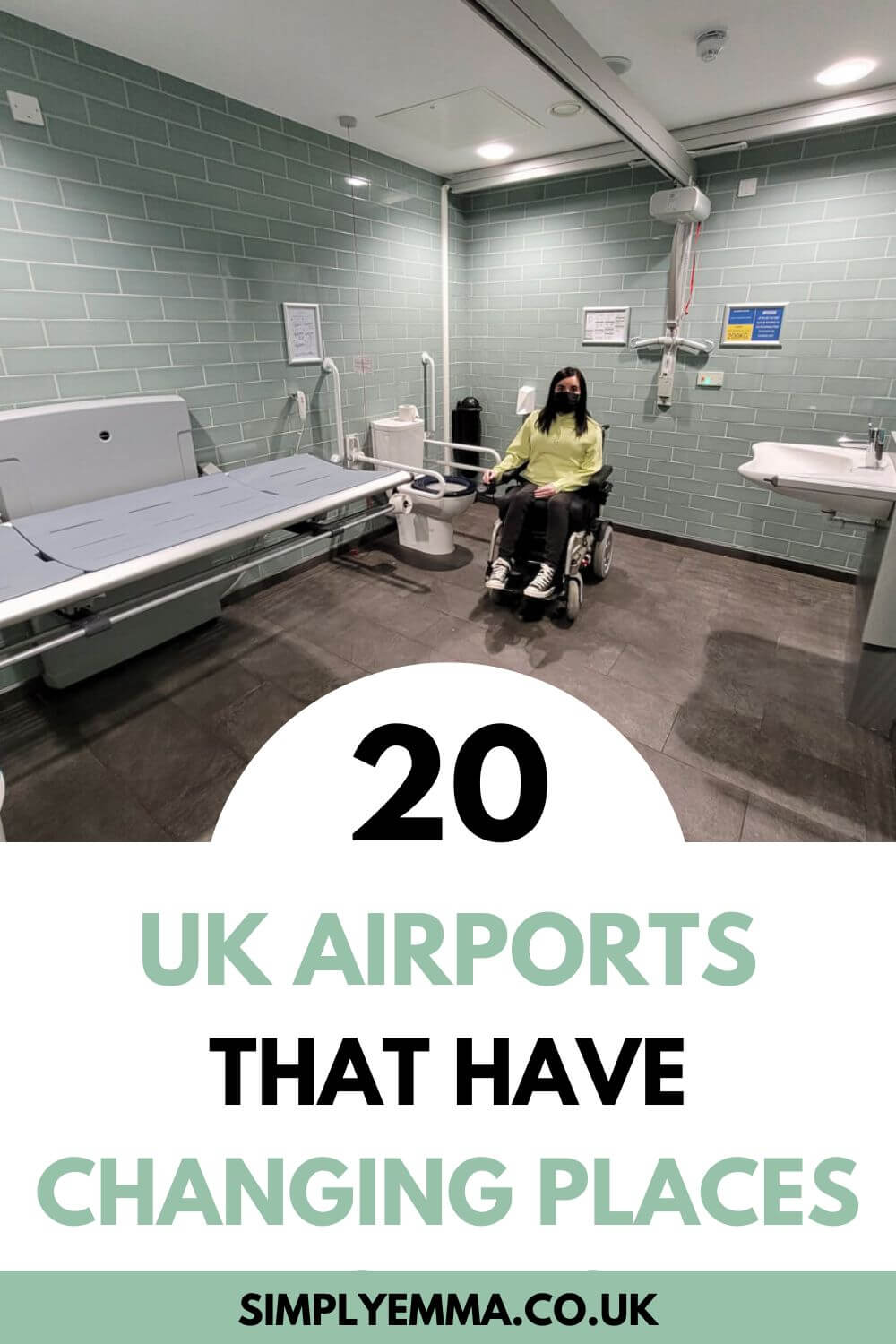 Emma, a white female powerchair user with dark shoulder length hair is is a Changing Places toilet. The walls are mint green brick tiles and the floor is grey slate tiles. There is adult-sized changing bed, peninsular toilet and sink, ceiling-track hoist, grab rails and a shower. Text reads "20 UK airports that have Changing Places"