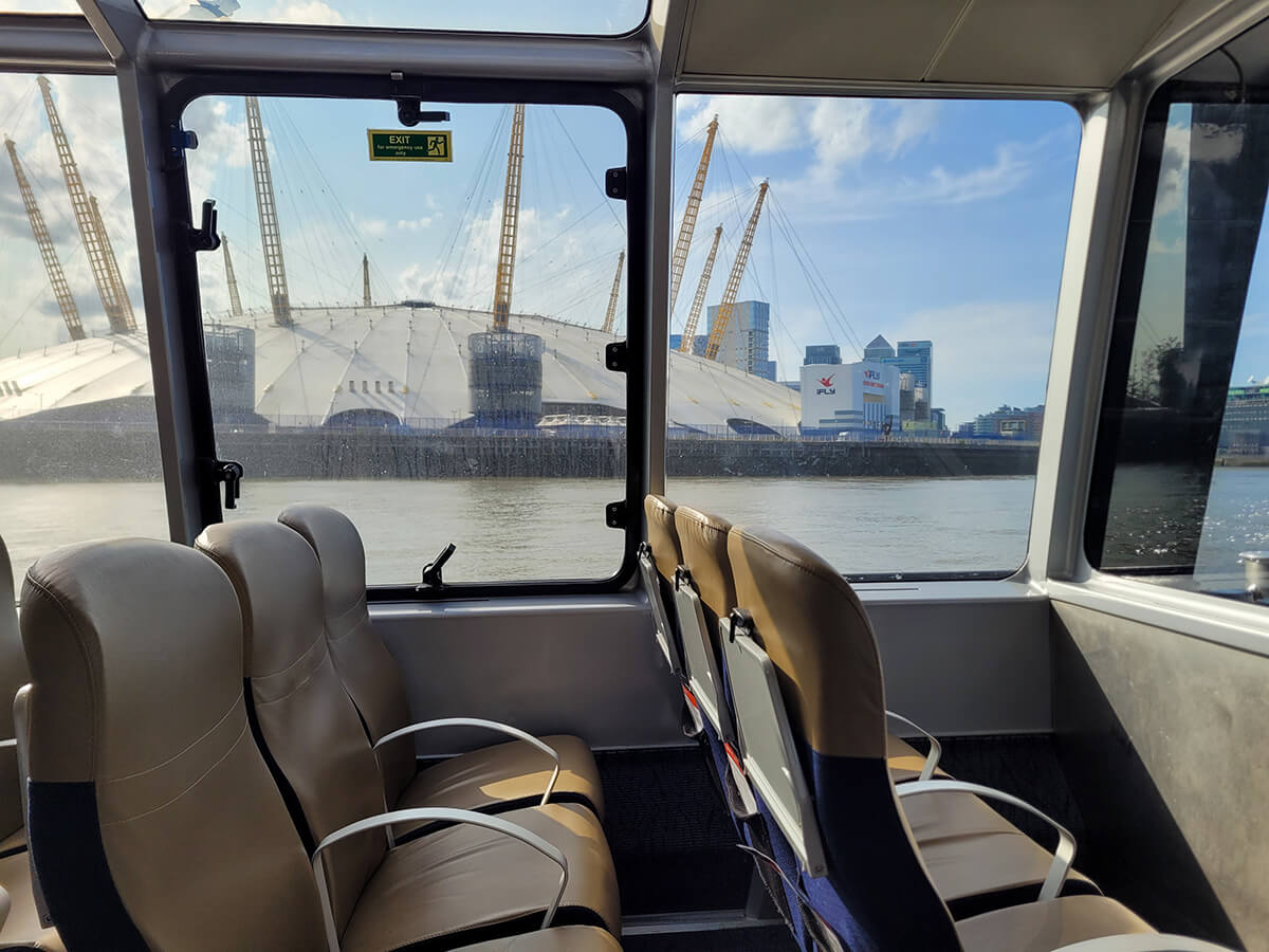 View of The O2 from inside the Uber Boat on a sunny day.