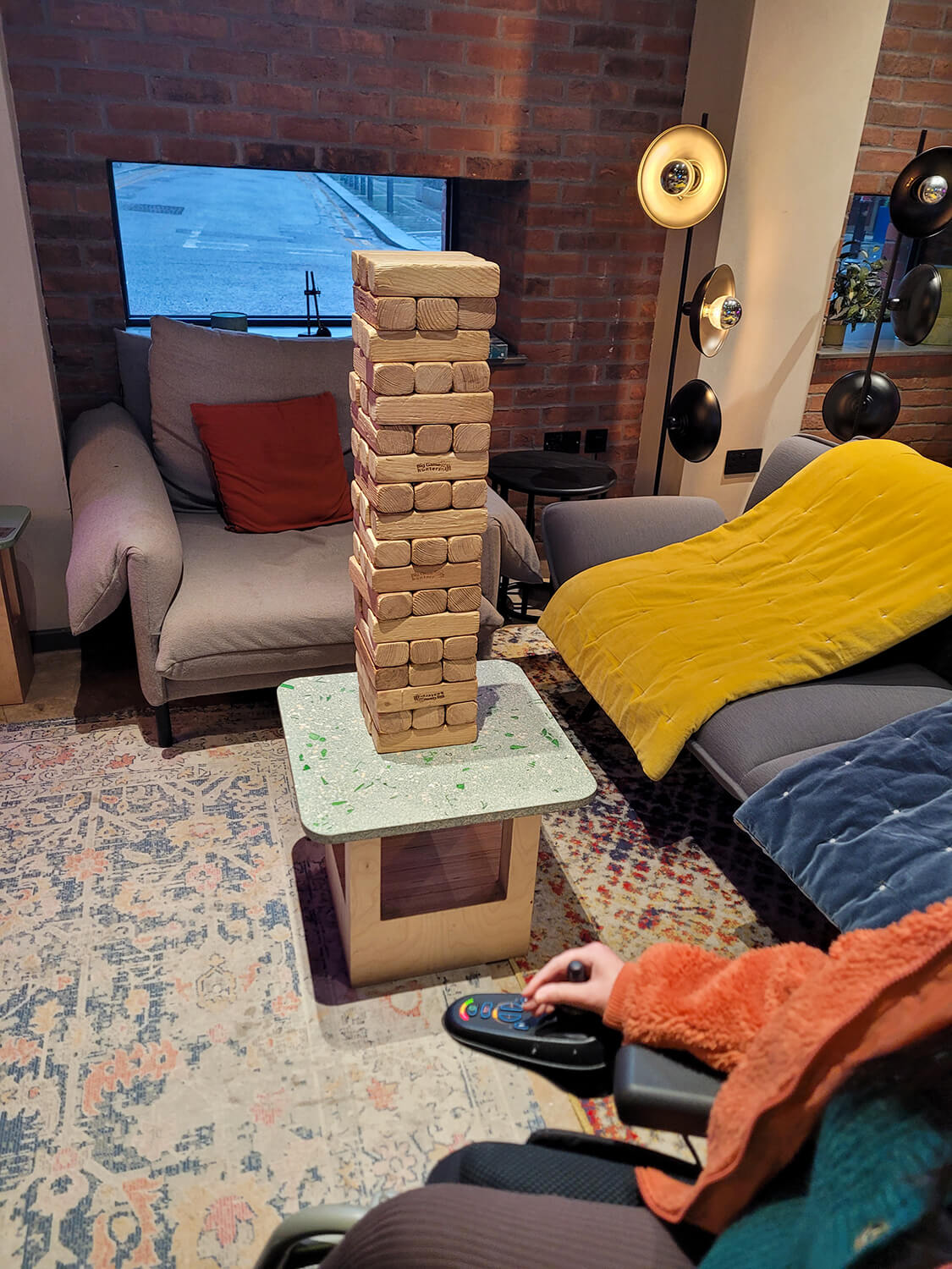 A giant jenga game in the social space at at the Moxy Manchester City hotel.