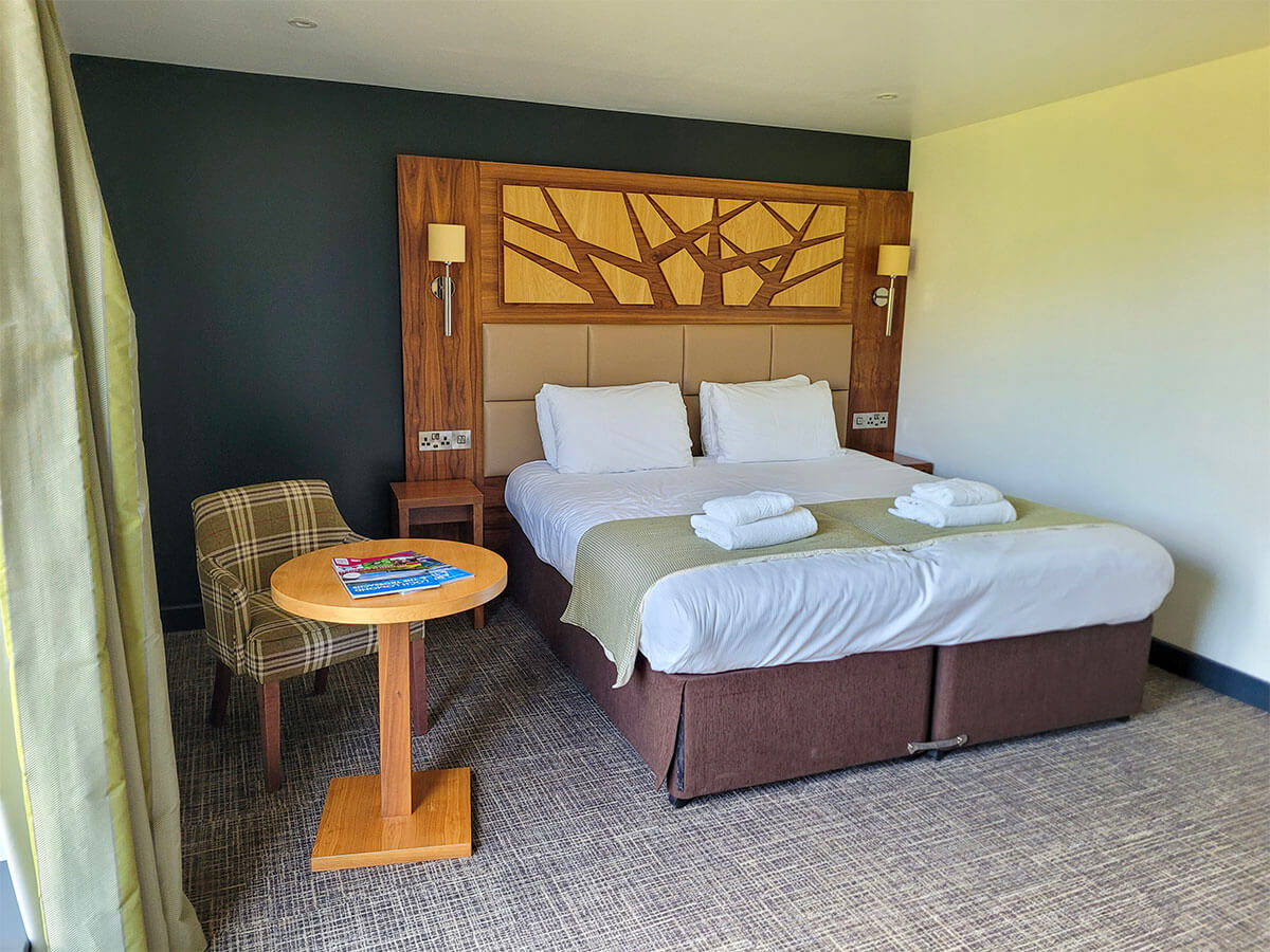 The double bed in wheelchair accessible room at the Drimsynie Holiday Village hotel, Argyll
