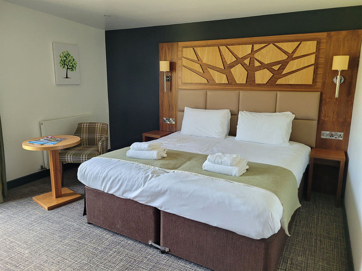 The double bed in wheelchair accessible room at the Drimsynie Holiday Village hotel, Argyll