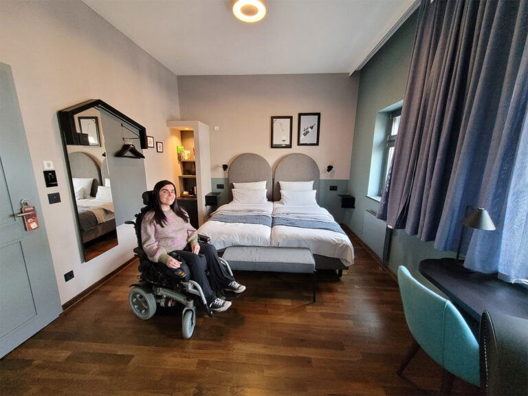 Emma sat in her powered wheelchair in the wheelchair accessible room at The Circus Hotel, Berlin