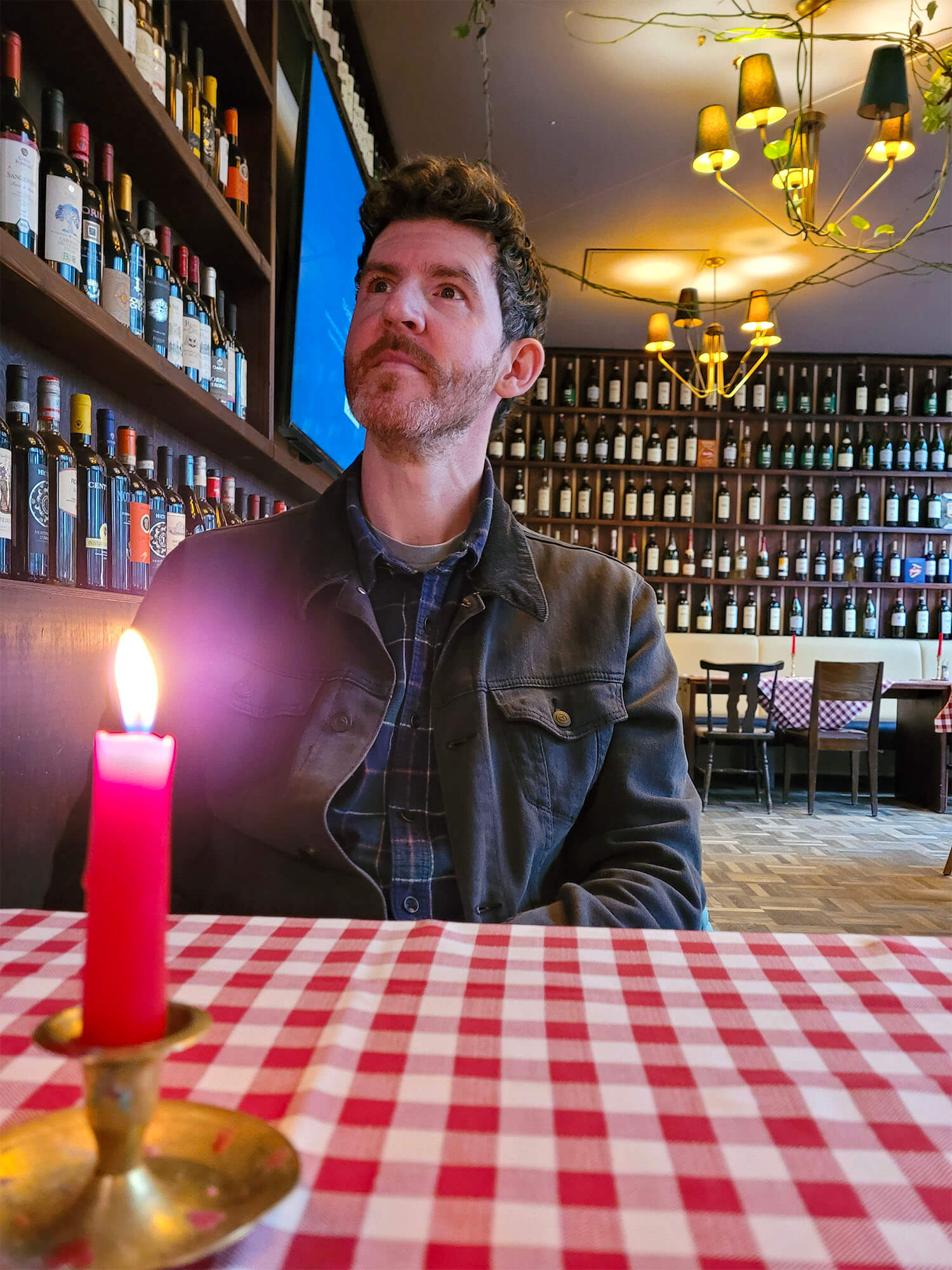 Allan sat at a table in the Italian restaurant, La Cantina in Berlin.