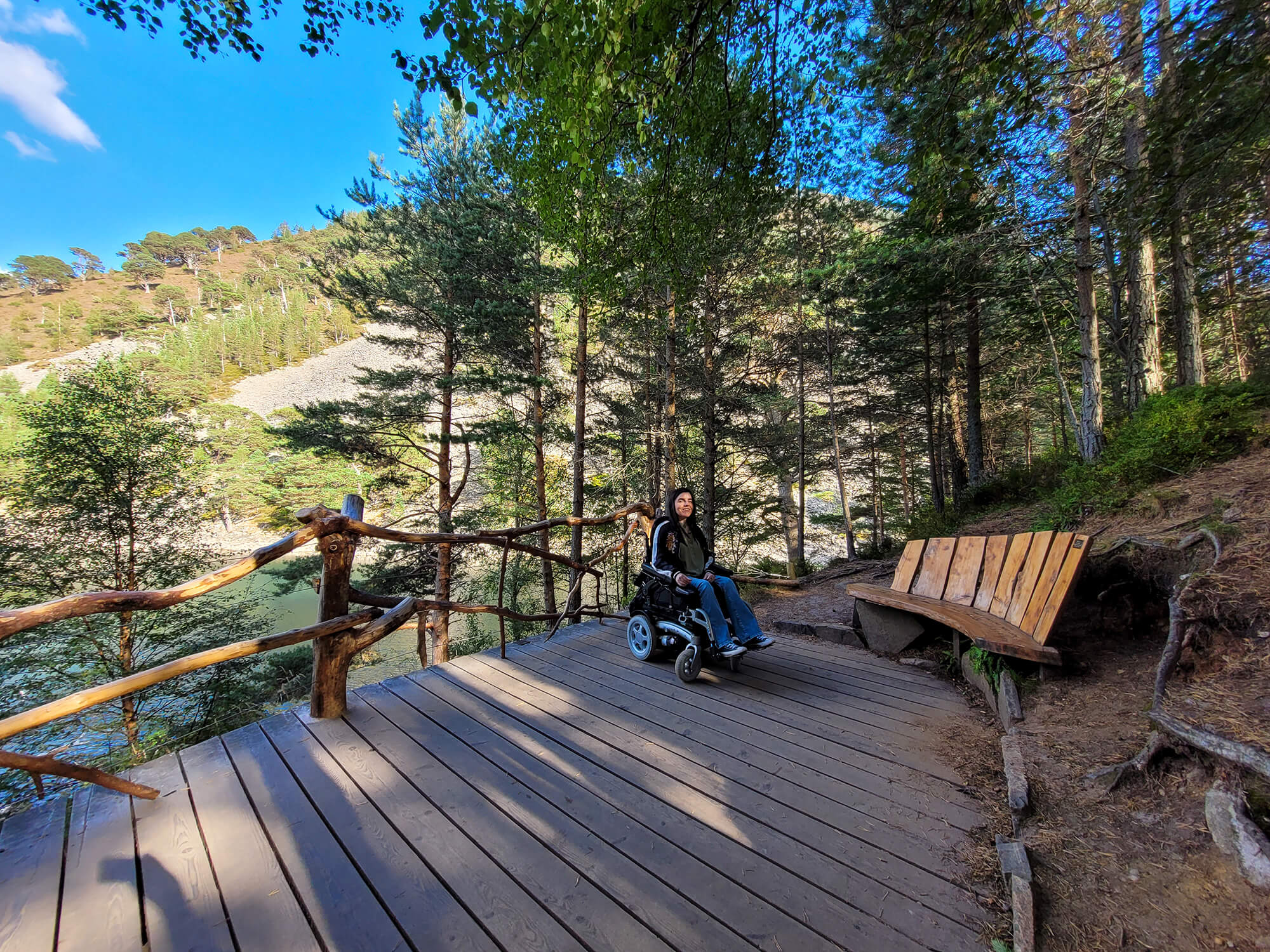 Emma sat in her wheelchair on the viewing platform at an Lochan Uaine, the Green Loch.