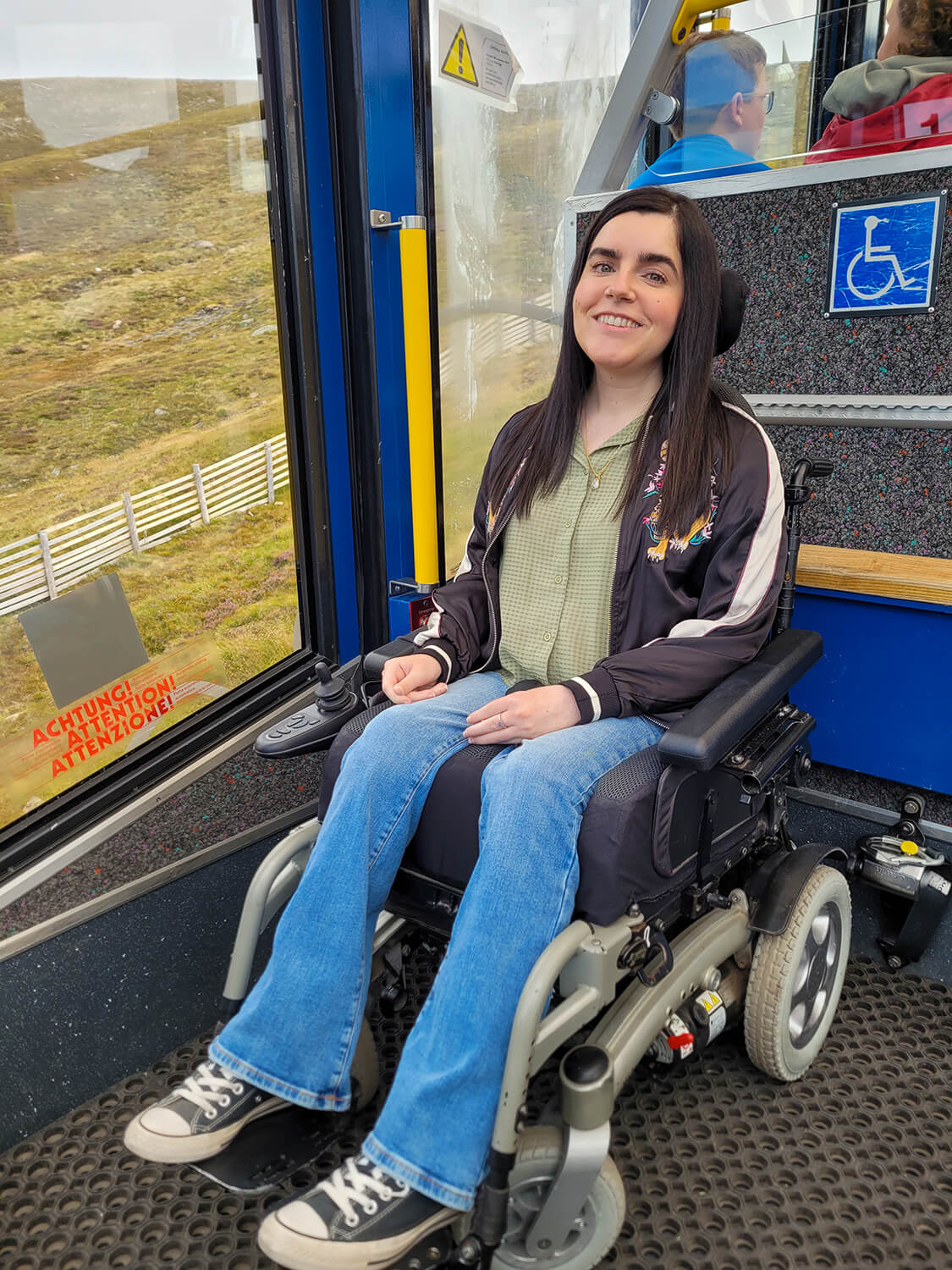 Emma sat in her wheelchair inside the Cairngorm Mountain Resort’s funicular railway
