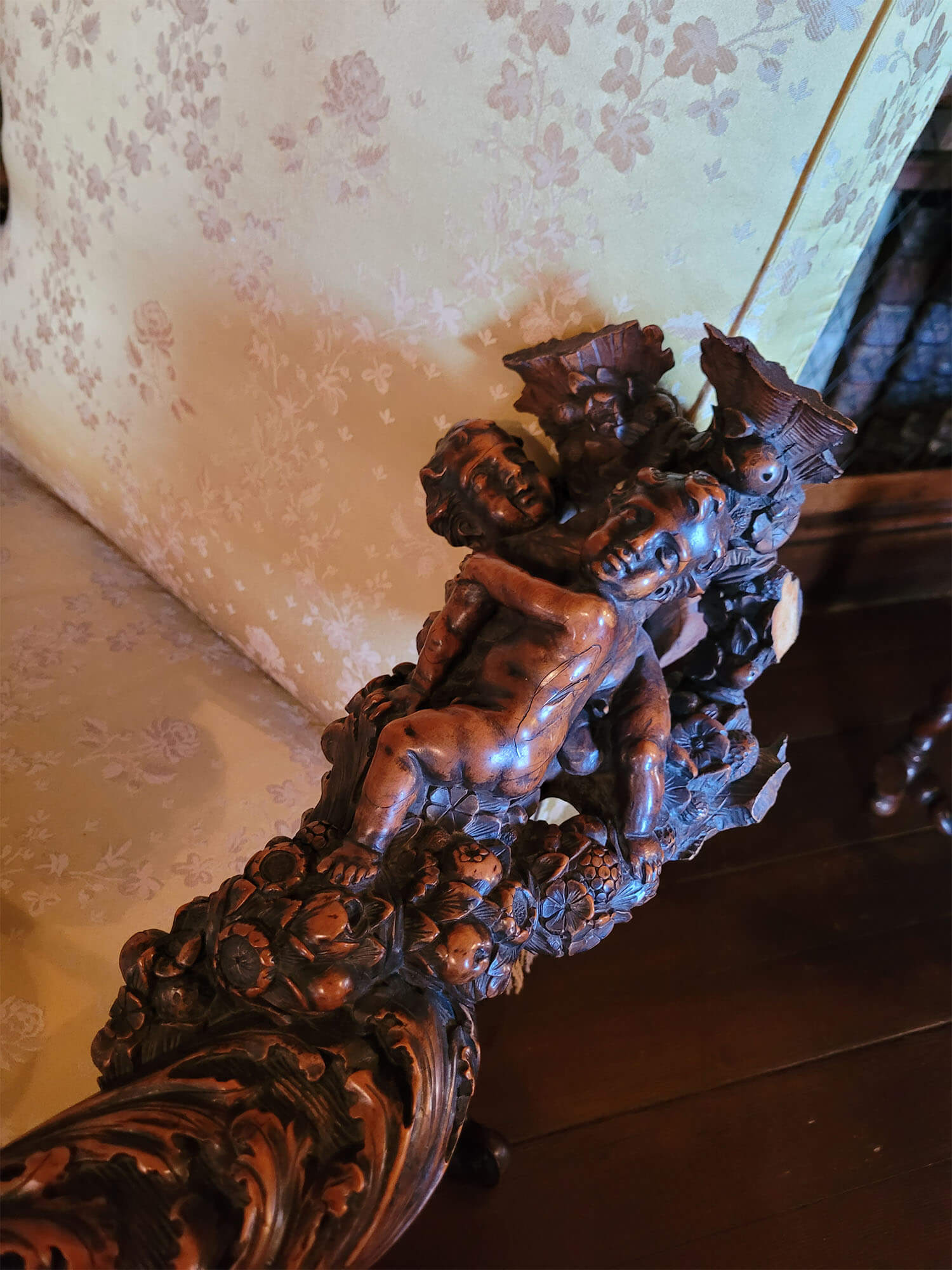 a close up of a wood carving armchair