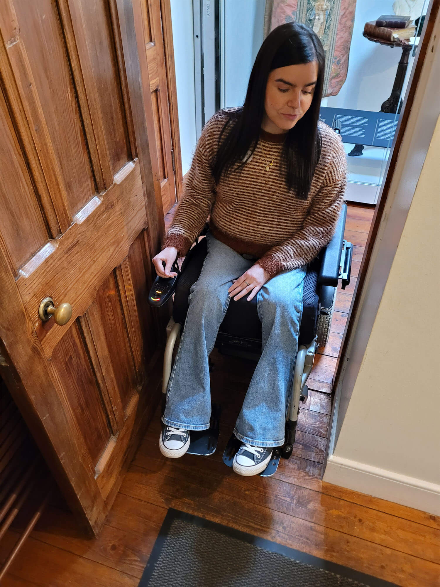 Emma, a powerchair user inside the Chapel at Abbotsford.