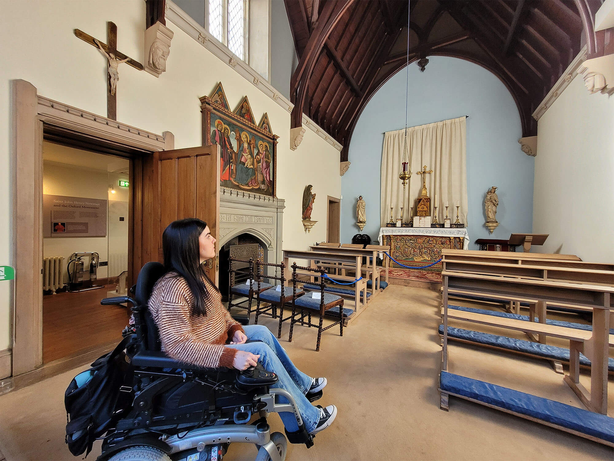 Emma, a powerchair user inside the Chapel at Abbotsford.