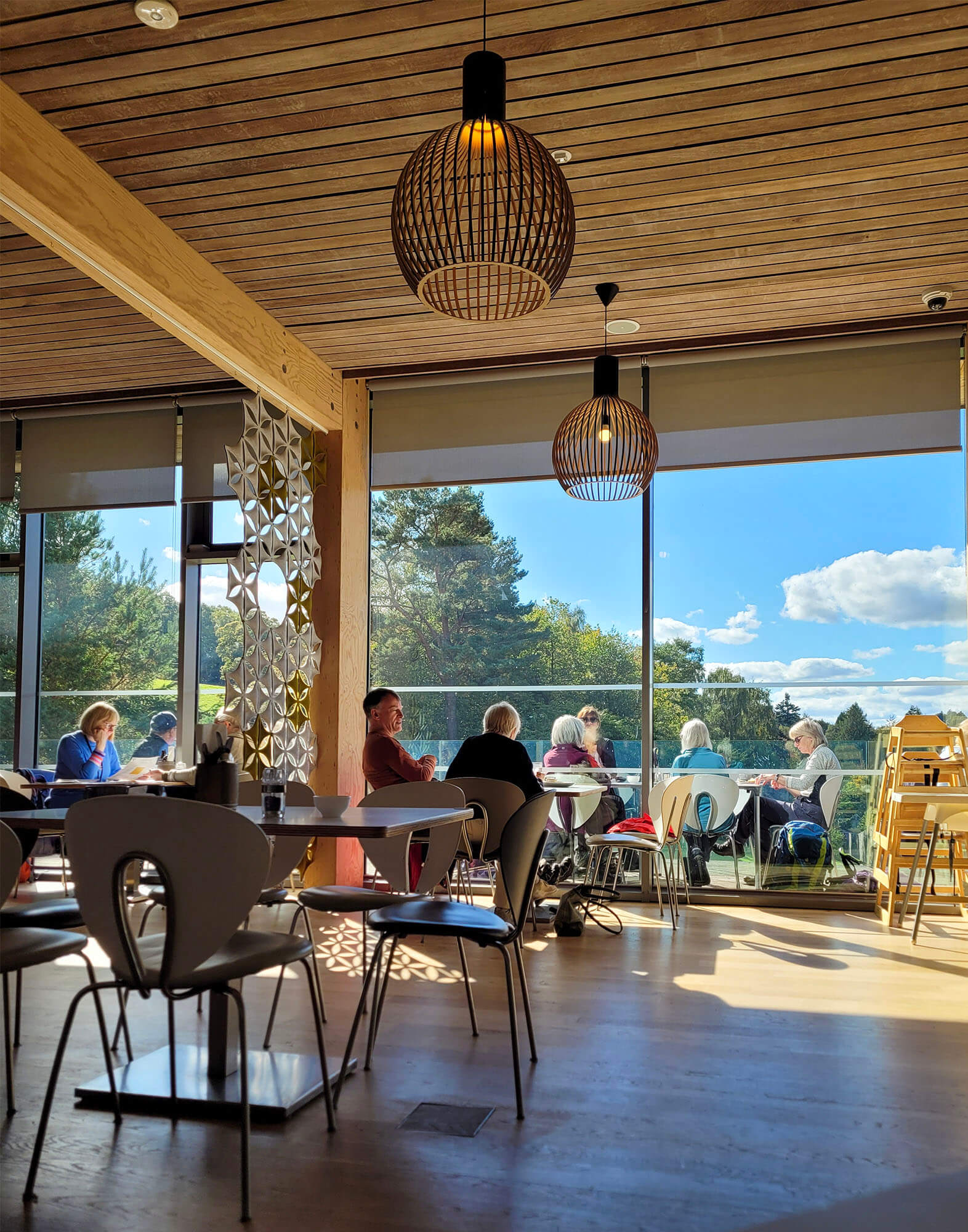 People sitting at tables in the Ochiltrees Cafe at Abbotsford