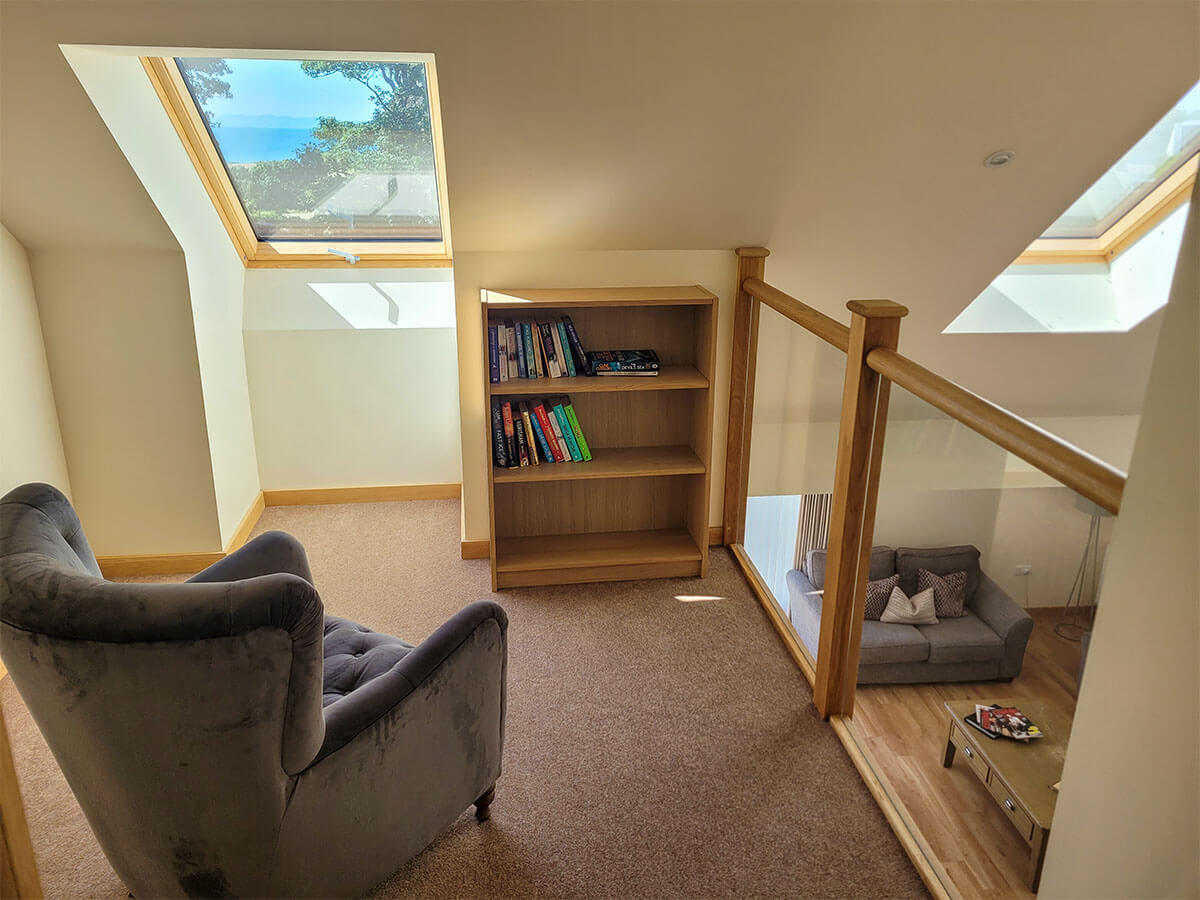 upstairs library nook, which has a balcony overlooking the downstairs living area