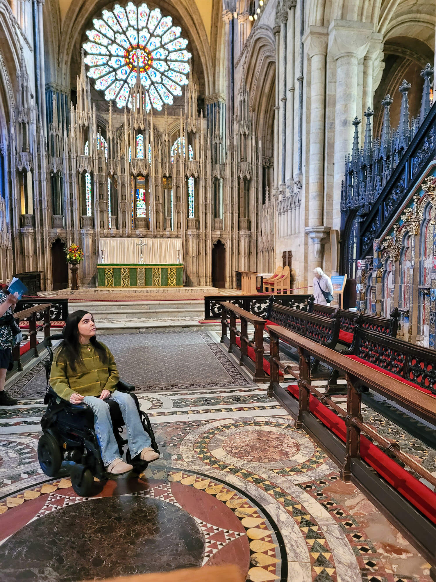 Emma, a female powerchair user inside Durham Cathedral